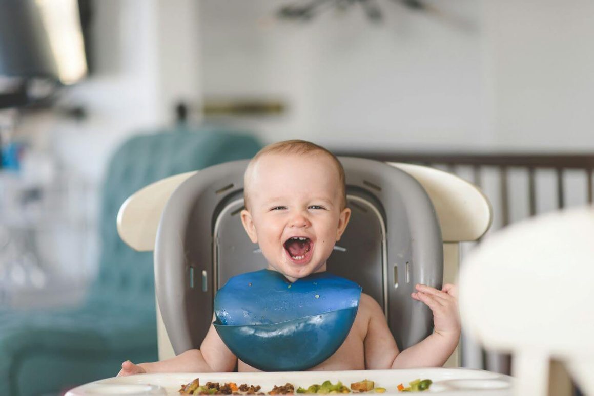 Healthy Baby Food - picture of a jovial baby eating